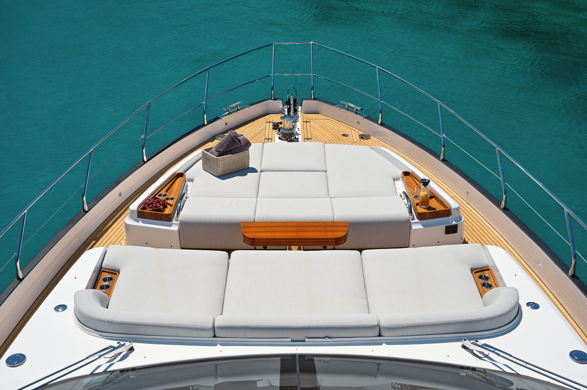 Foredeck lounge with a large sunpad and forward-facing settee