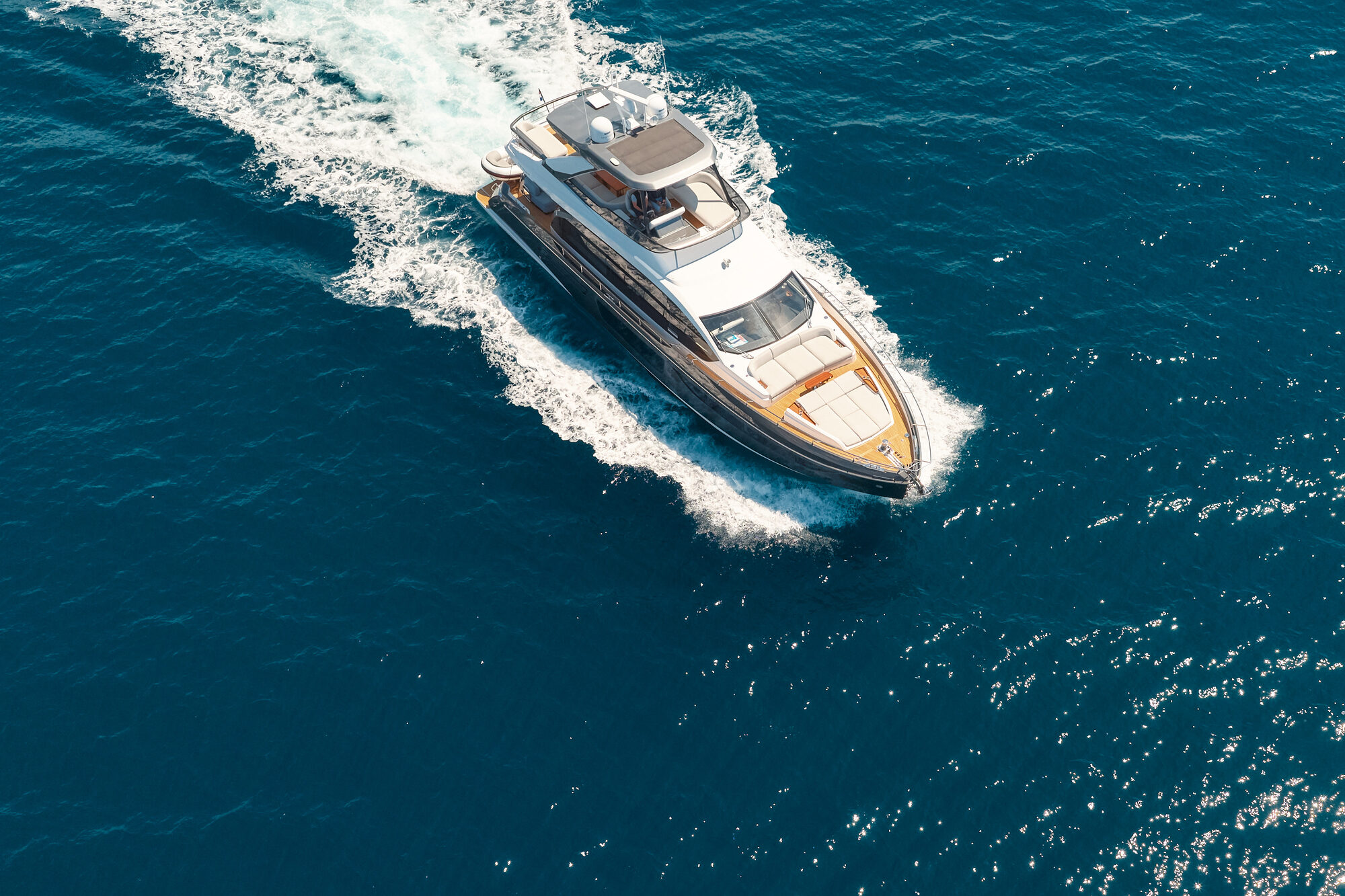Pangea cruising across dark Adriatic water at dusk