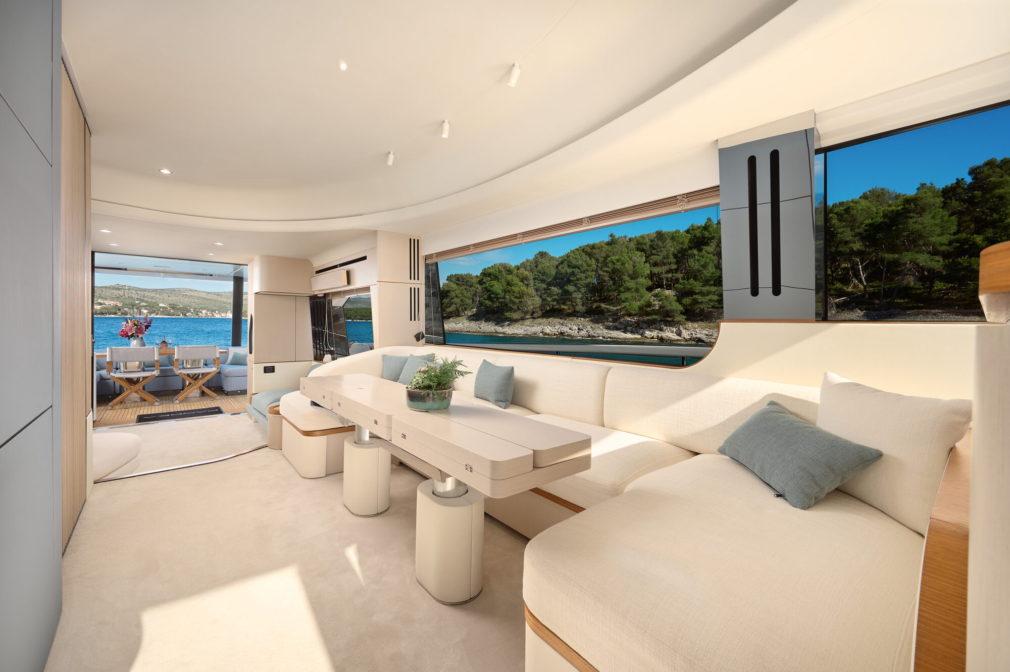 Main salon with cream sofas and wraparound windows